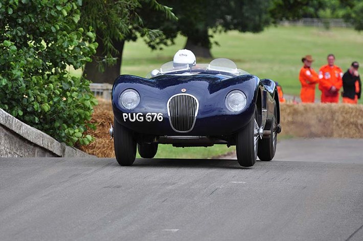 Jaguar C Type1952 of Ben Cussons flies over the hump back bridge